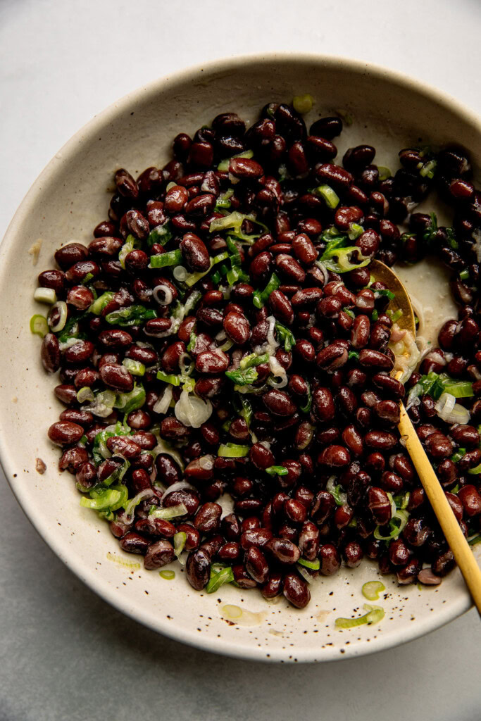 Mixing the scallion oil with the black beans.