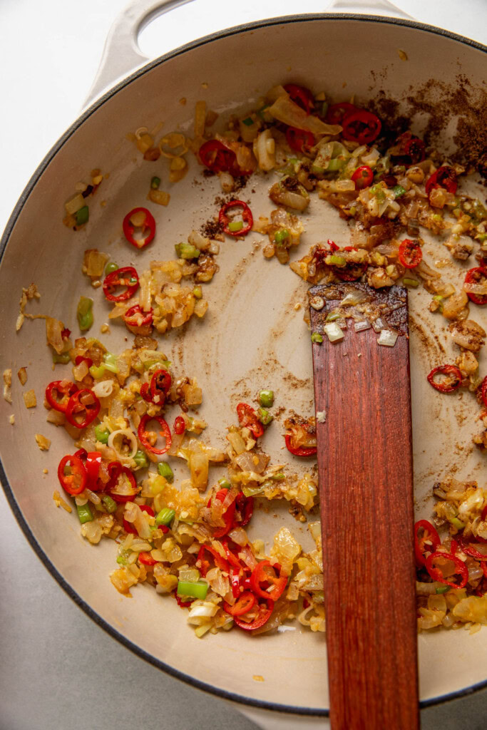 Deglazing the sauteed onions, peppers, and scallions with some mirin.
