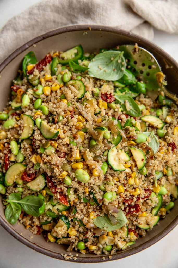 Large mixing bowl with mixed quinoa and corn salad.