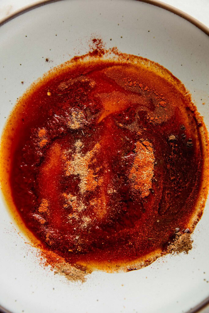 Chipotle sauce mixed with tamari, agave, and spices in a bowl.