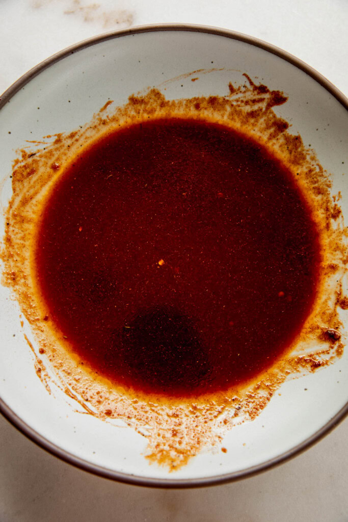 Mixed chipotle marinade in a shallow bowl.