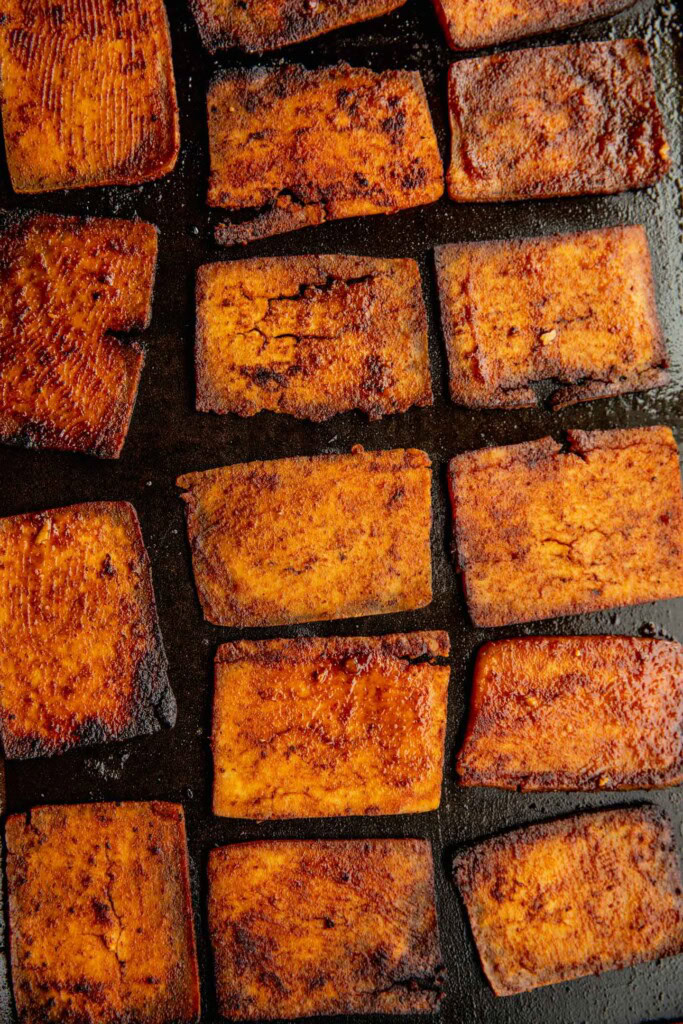 Cooked deli slices on a griddle.