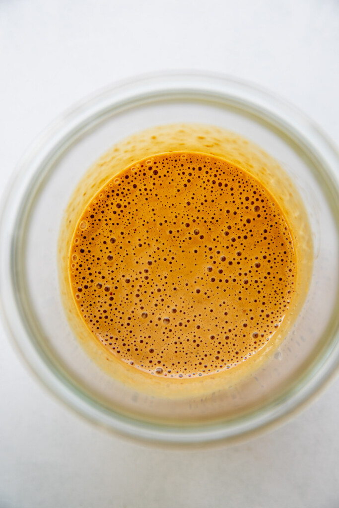Blended sesame chili sauce in a blender cup.