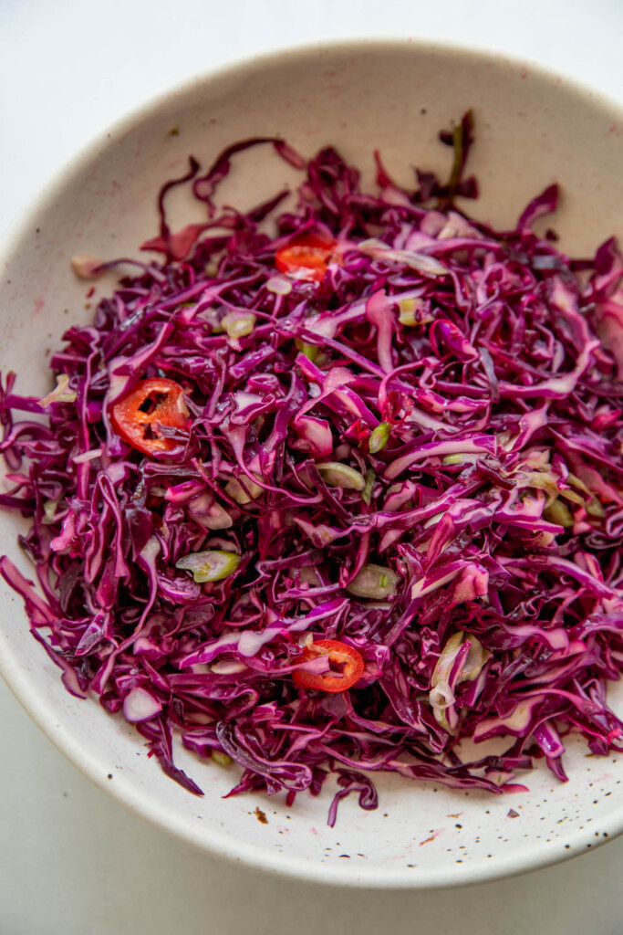Softened mixed cabbage in a mixing bowl.