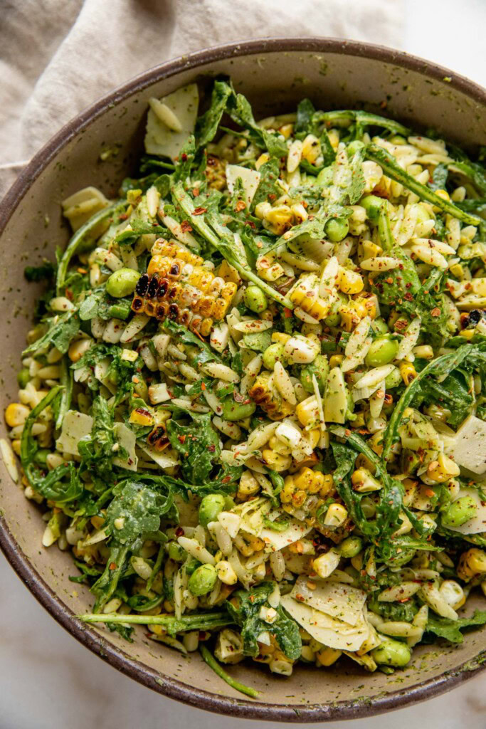 Bowl of marinated orzo and grilled corn salad.