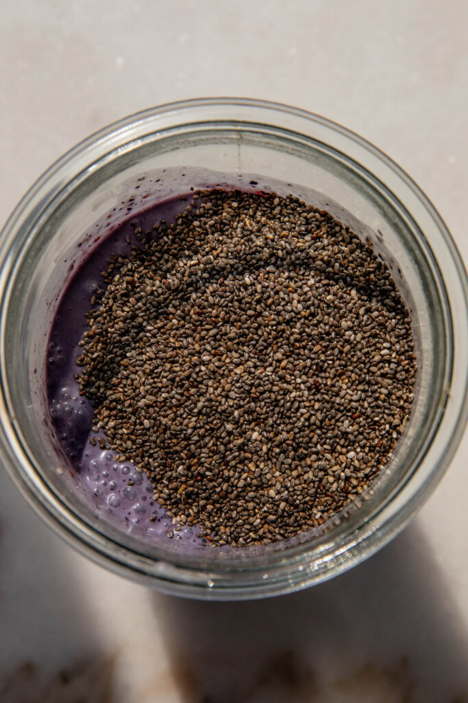Adding the chia seeds to the blueberry muffin milk.