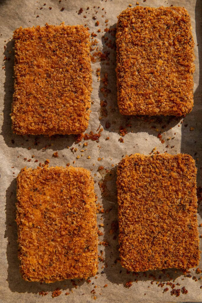 Baked golden tofu on a baking tray.