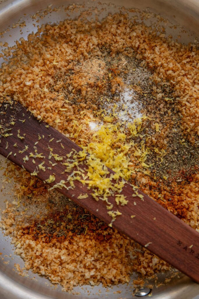 Stirring in the seasoning into the toasted panko.