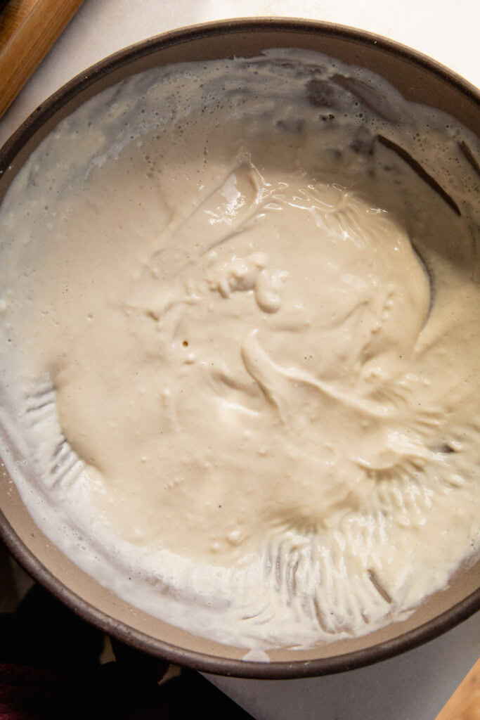 Thick pancake batter mixed in a mixing bowl.