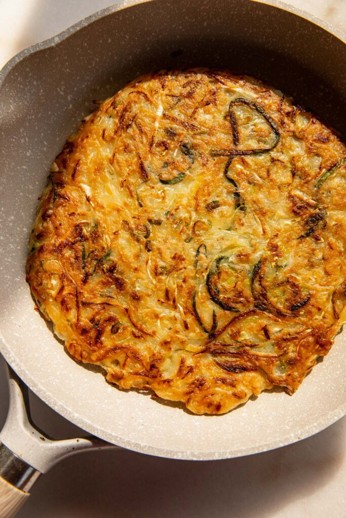 Golden cooked pancake in a pan.