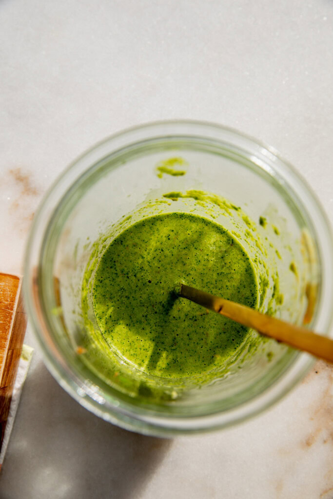 Blended Zhug dressing in a jar.