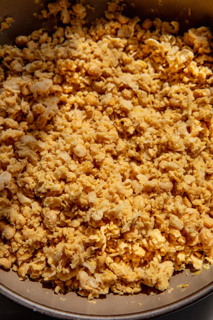 Mashed chickpeas in a bowl.
