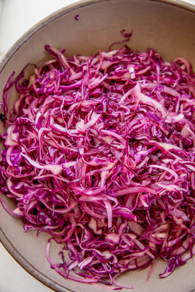 Cabbage slaw after mixing with the dressing.
