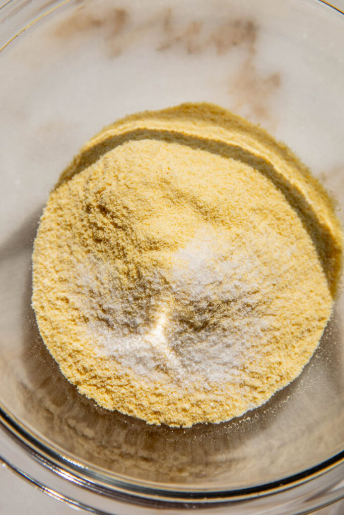 Cornmeal and salt in a bowl.