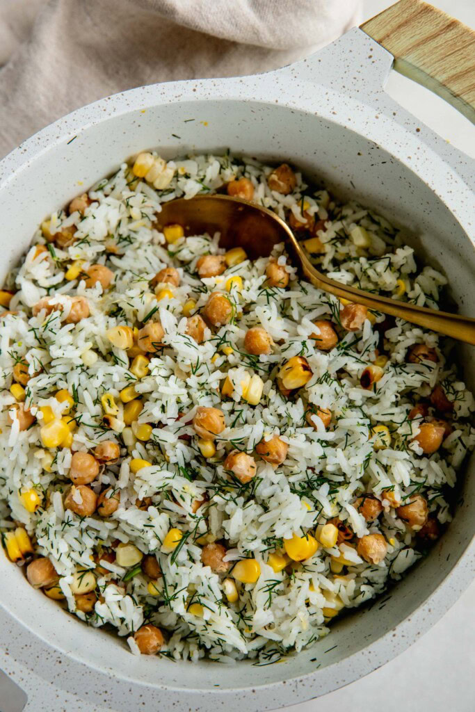 Rice pot after mixing the rice, chickpeas, corn, and herbs together.