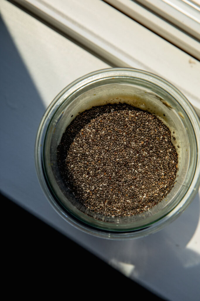Adding chia seeds to the blended milk.