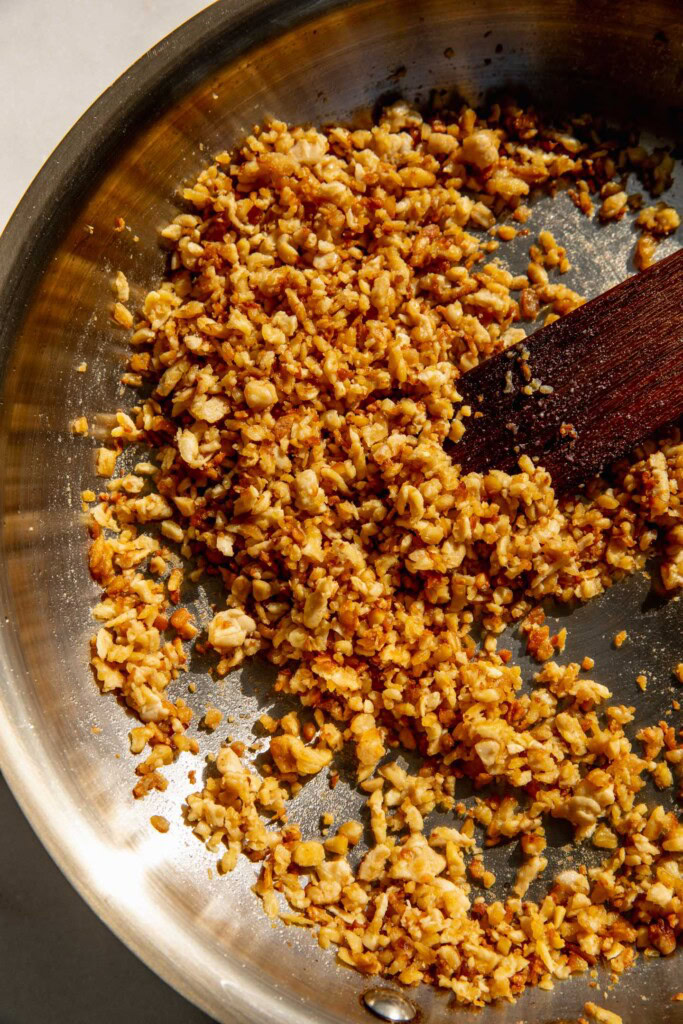 Stir-fried tempeh in a pan.