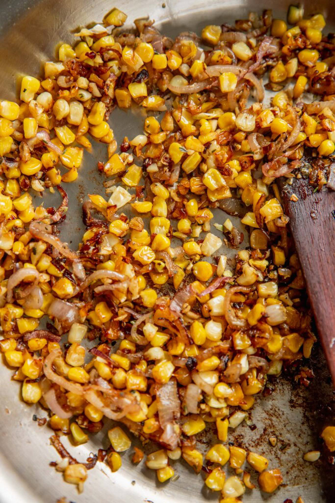 Sauteeing the herbs along with the corn and shallots.