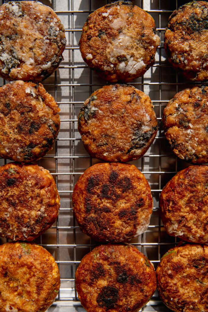 Cooked tofu patties cooling on a wire rack.