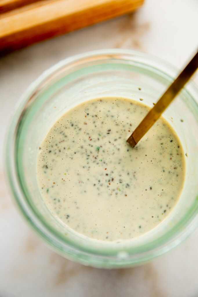 Stirring together the chia seeds into the milk.