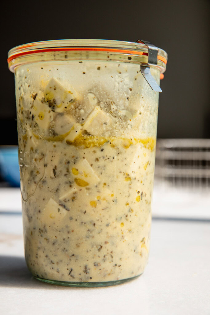Tofu marinated in a storage container overnight.