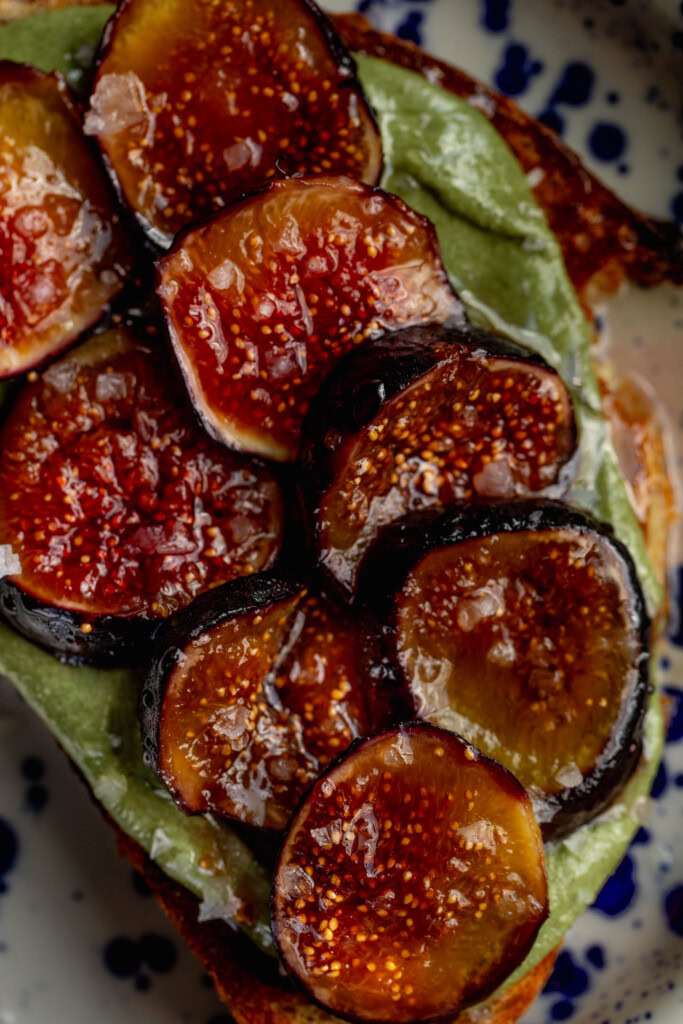 Toast topped with pumpkin seed butter and caramelized figs.