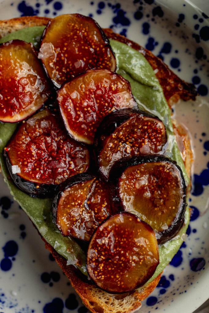 Toast topped with creamy pumpkin seed butter with caramelized fig slices on top.