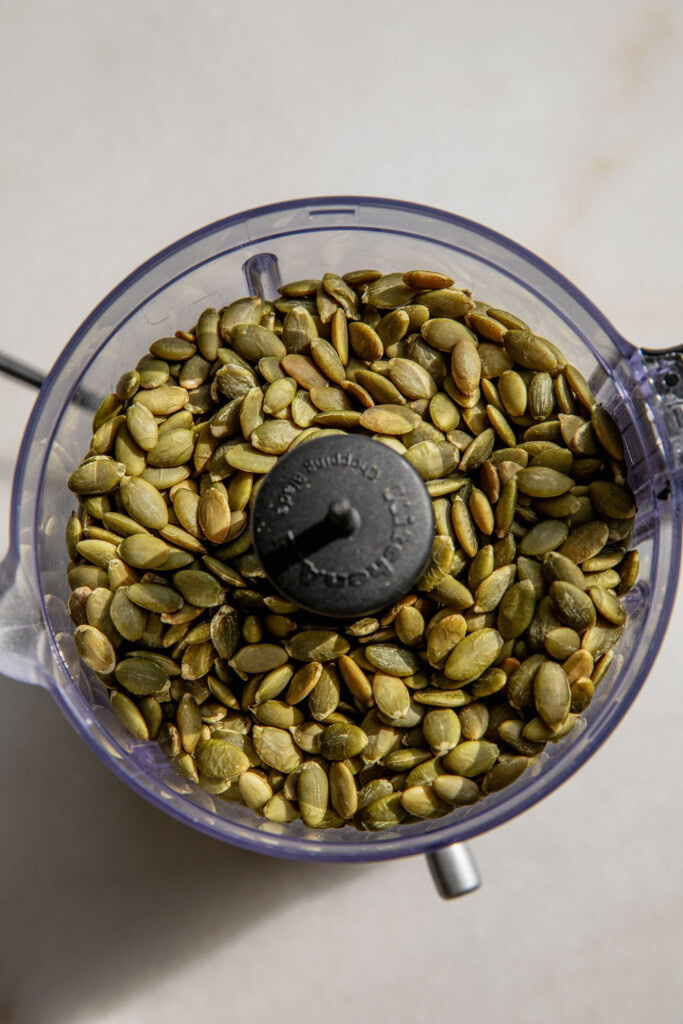 Pumpkin seeds in a food processor.