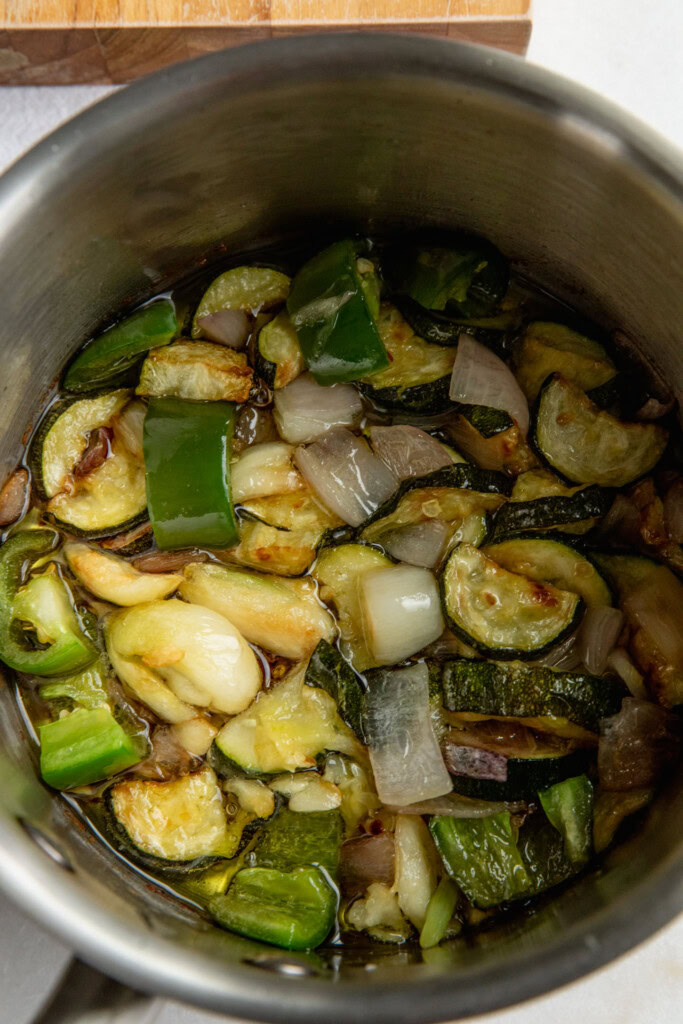 Golden cooked zucchini, shallots, garlic, and jalapeño.