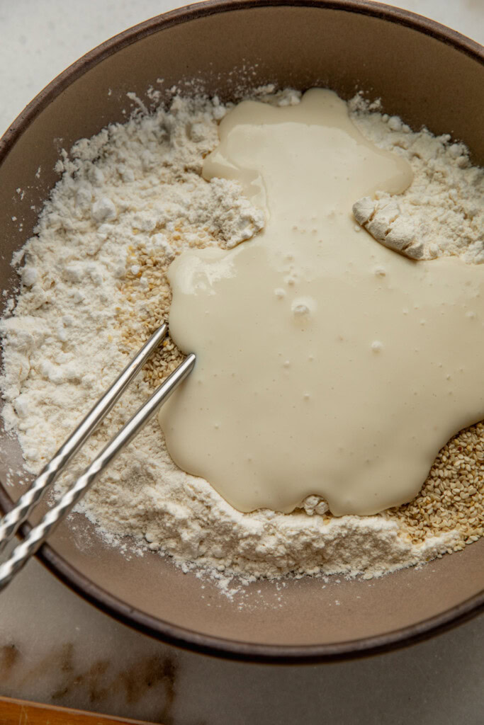 Blended tofu and flour in a mixing bowl.