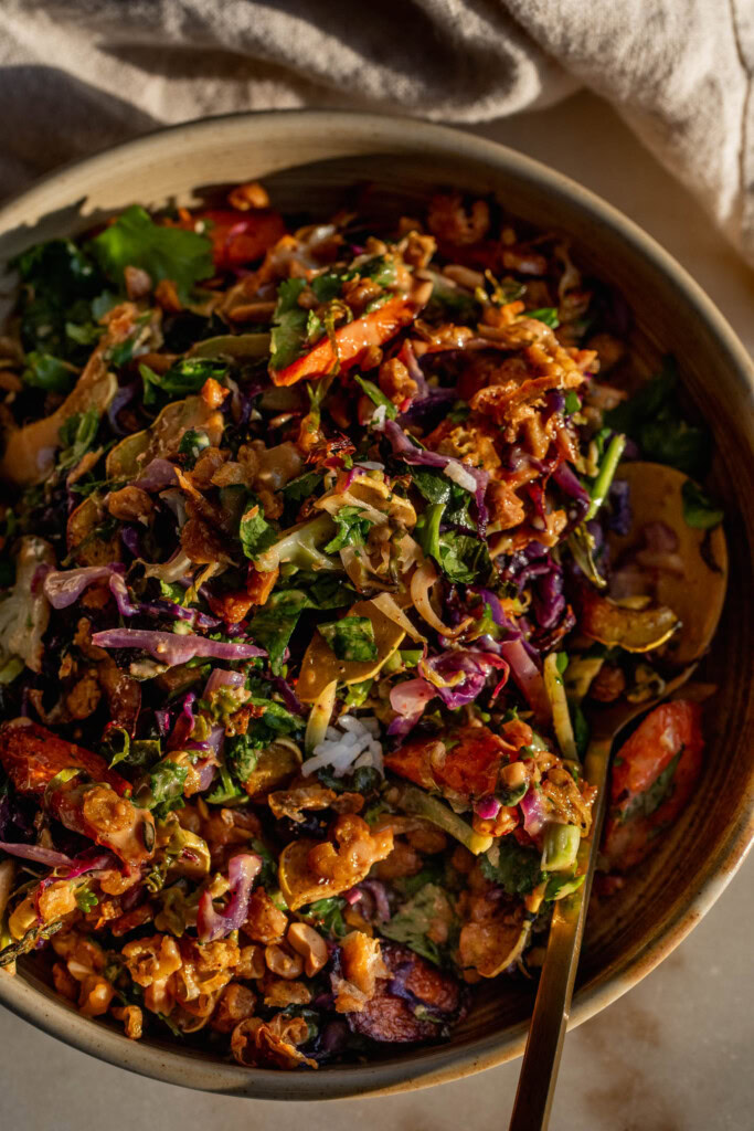 Baked salad mixed together with roasted carrots, chickpeas, and peanut hoisin sauce.
