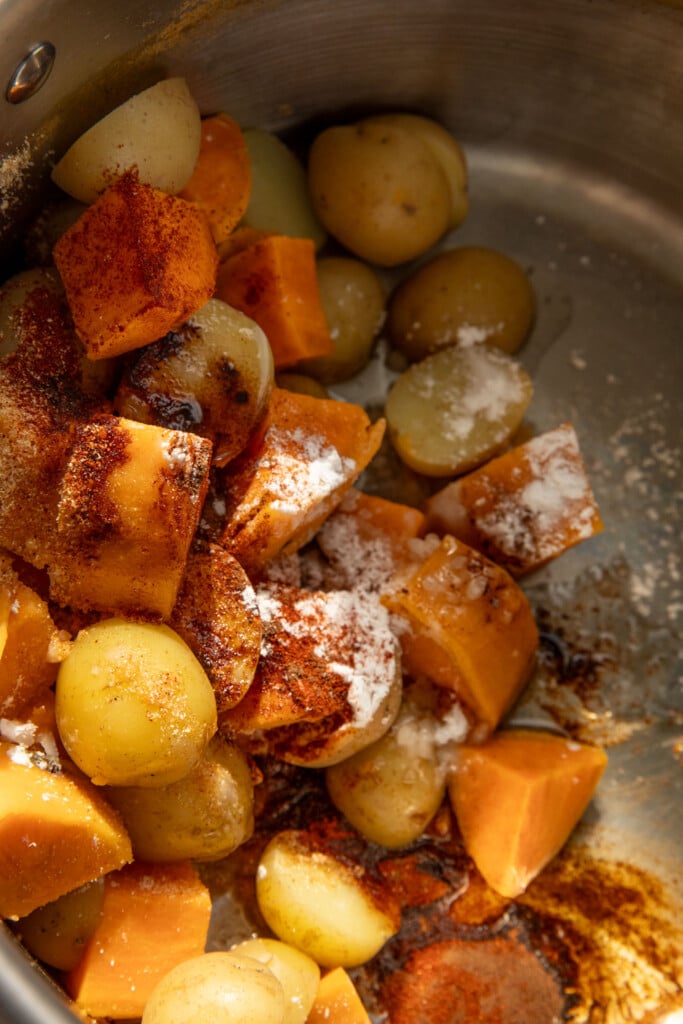 Seasoned potatoes in a pot.